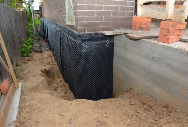 Happy homeowners after waterproofing job in Burlington